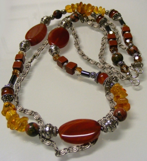 A Potpourri of Gemstones, Crystals, and Sterling Silver in Reddish Brown...
