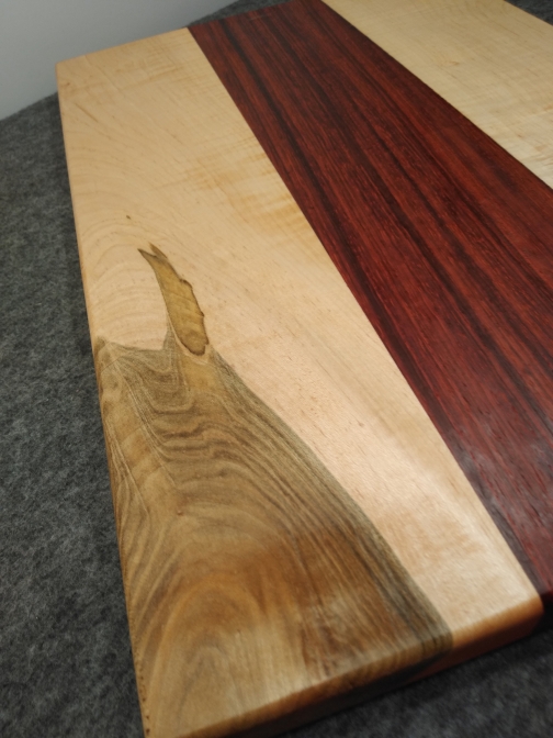 Figured Maple and Padauk Face Grain Cutting Board by Clintswoodcrafts