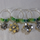 four distinctive flowers on each wine glass ring