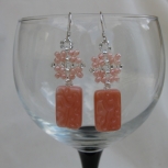 Peach beads dangle prettily below a beaded motif