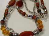  A Potpourri of Gemstones, Crystals, and Sterling Silver in Reddish Brown and Golden Hues