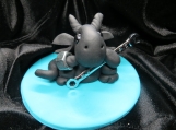Black dragon with a wrench figurine / cake topper