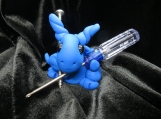 Blue dragon figurine with a screwdriver