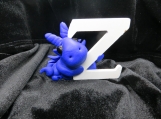 Blue polymer clay dragon with the letter Z small cake topper