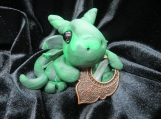 Green swirl dragon sculpture
