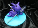 Purple dragon with a screwdriver figurine/cake topper