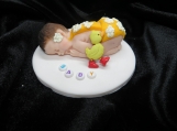 Small baby figurine with daisy outfit / baby shower cake topper