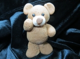 Standing teddy bear figurine
