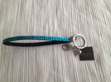 Turquoise wristlet keychain Braille word "Home" on copper square