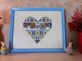 Cross stitched sampler heart