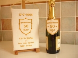 50th wedding anniversary wall hanging and bottle collar