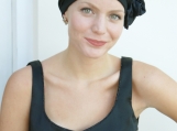 Black cocktail evening hat with crystal pin for cancer patients