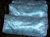 3 Icey blue lame' pillows with snowflake overlay.