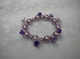 Light mauve pearl  bracelet with white and purple flowers