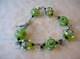 GREEN WITH ENVY-- Wire wrapped funky green square lampwork beaded bracelet.