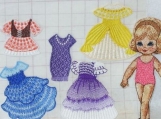 Pretty machine embroidered paper doll with 5 sets of clothes in pink suit