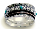 On the edge - Sterling silver integrated 9K yellow gold spinner and turquoises ring.