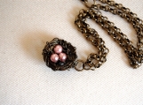     Bird nest necklace with pink pearl