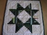 Quilted Green Log Cabin Star Table Topper