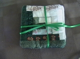 Quilted green log cabin coasters