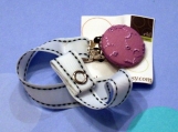 purple eyelet flower pacifier clip