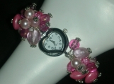 Charm bracelet style pink watch with heart watch face