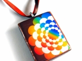Rainbow flower on brown background pendant