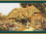 Woman Before A Cottage Cross Stitch Pattern