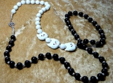 Three Little Kitten Face Necklace With White and Black Beads