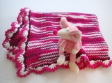 Handknitted cotton blanket for a baby girl