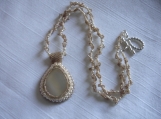 Beaded cream carbochon and beaded chain necklace.