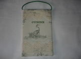 A fabric kitchen/cuisine wall hanging