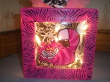 hand painted 8 x 8 lighted glass block in cheshire cat design. 