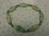 Paper bead bracelet mde from recycled scrapbook paper