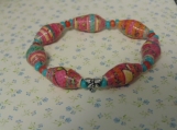 Paper bead child size bracelet with dragonfly charm