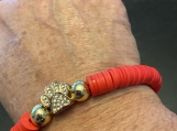 Paw and red heishi bead