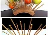 Unique wooden fruit holder where each fruit hangs in the air