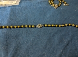 Black and Green beaded bracelet with Celtic Knot Symbol