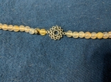Celtic Symbol bracelet with light green beads