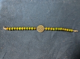 Green beaded bracelet with Irish Symbol