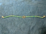 Sea green beaded bracelet with centre charm