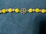 Shamrock with green beads and metal spacers bracelet