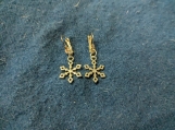 Snowflake earrings on closed shepherd's hooks