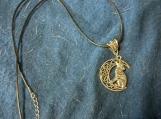 Wolf howling at the moon with Celtic Symbol necklace