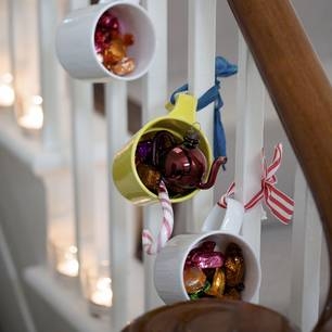Christmas decorating mugs and ribbons
