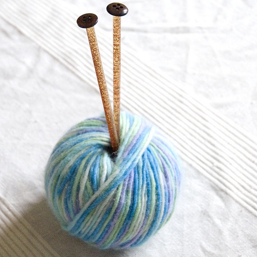 Knitting needles.