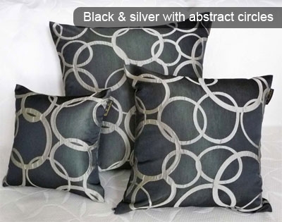 Black and silver pillows with abstract circles by Christine Skaley Reid from PillowThrowDecor