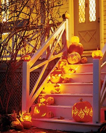 halloween porch decor with carved pumpkins