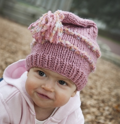 Fun pink pixie winter hat with novelty yarn stripes