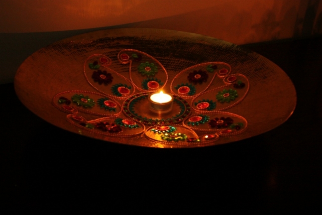 Rangoli or floral art on a bronze plate, Diwali
